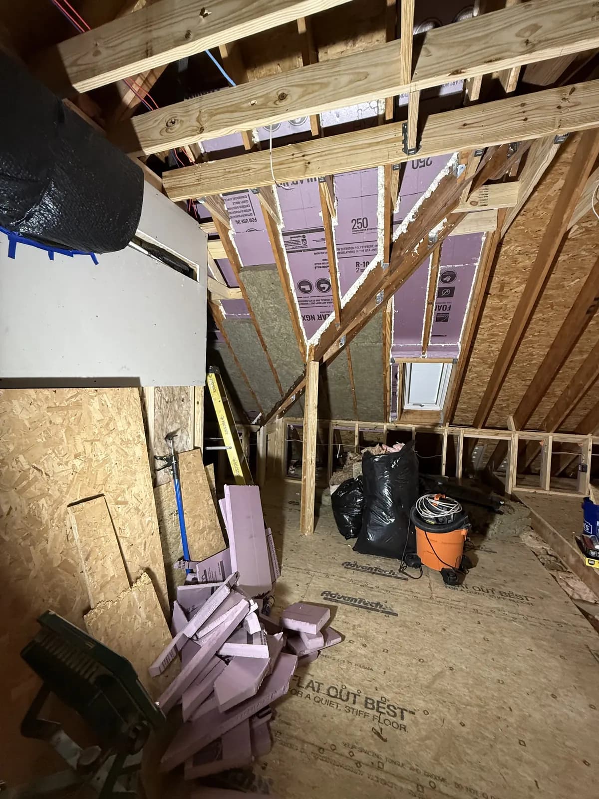 Attic conversion framing with rigid foam insulation between the rafters